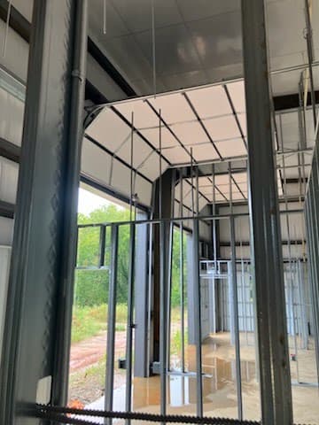 Commercial overhead garage door vertical track and frame installation