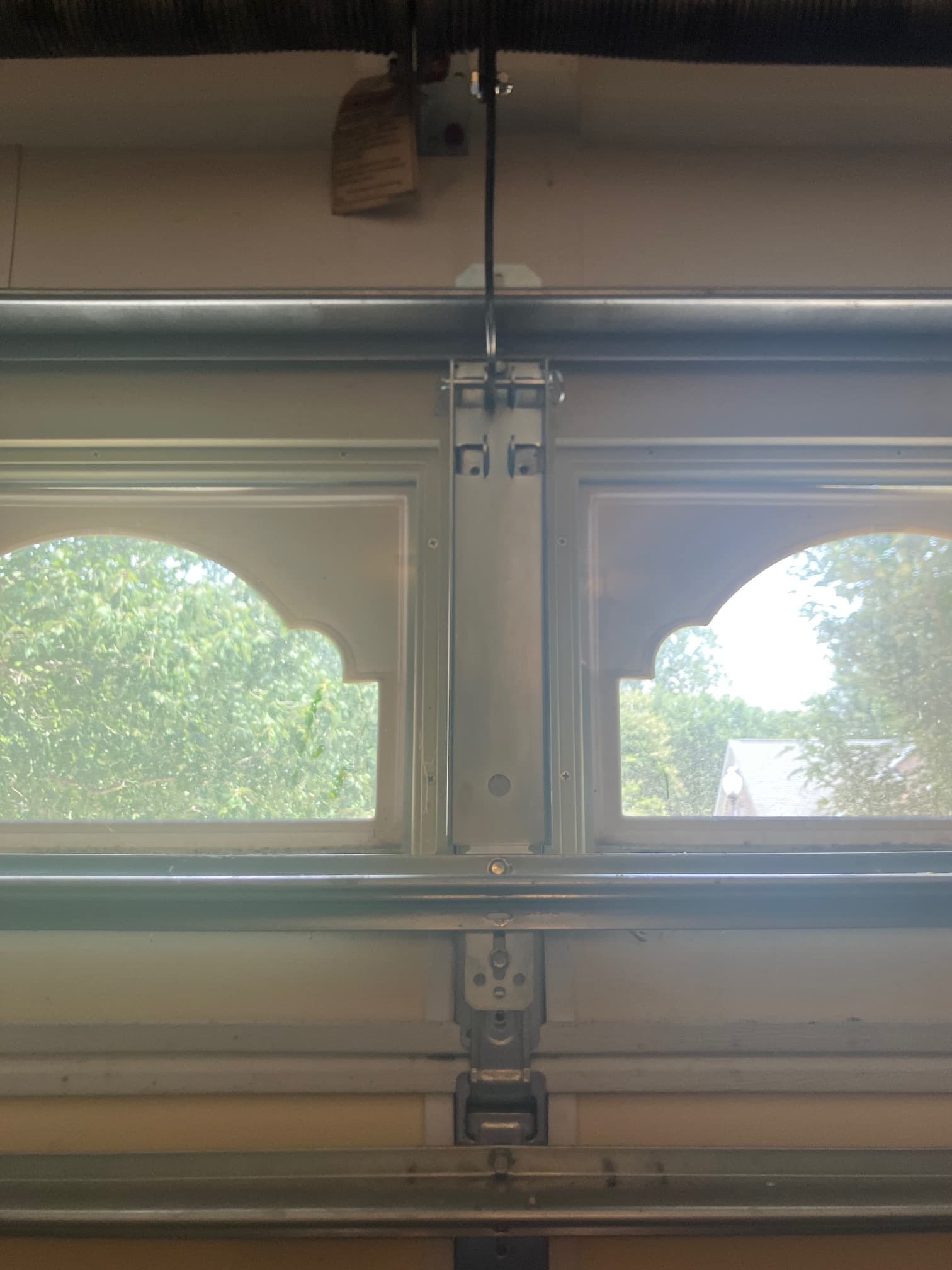 Interior view of opener mounting bracket and strut between door window panels