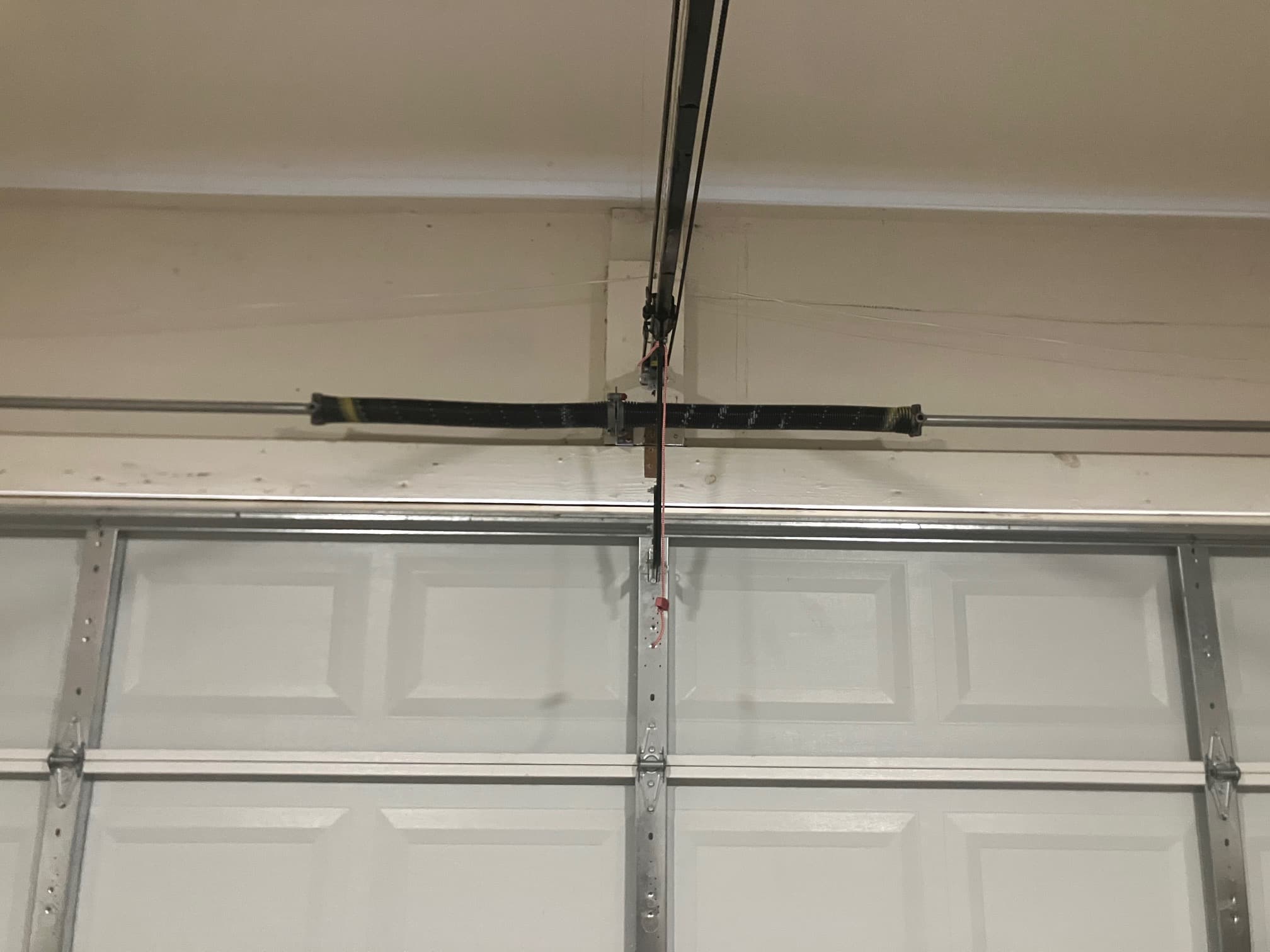 Newly installed and wound dual torsion springs